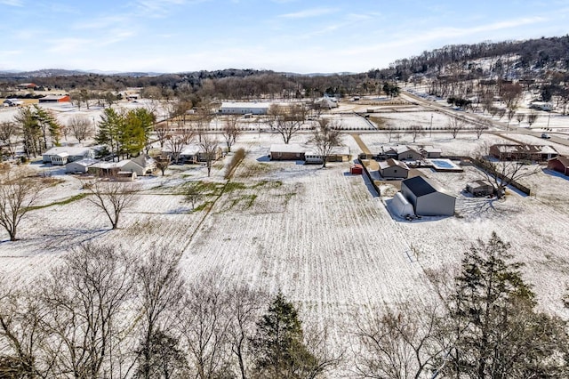 snowy aerial view featuring a residential view