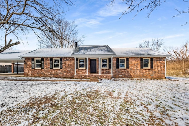 ranch-style home featuring brick siding, crawl space, and a chimney