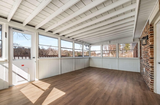 unfurnished sunroom featuring lofted ceiling with beams and wooden ceiling