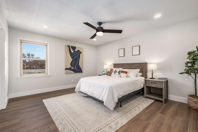 bedroom featuring dark wood-style floors, recessed lighting, baseboards, and a ceiling fan