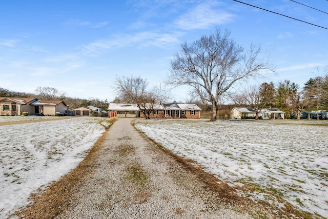 view of road featuring driveway and a residential view