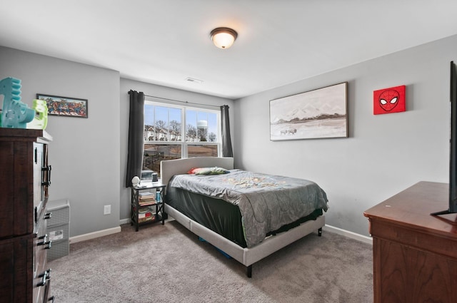 bedroom featuring carpet flooring and baseboards