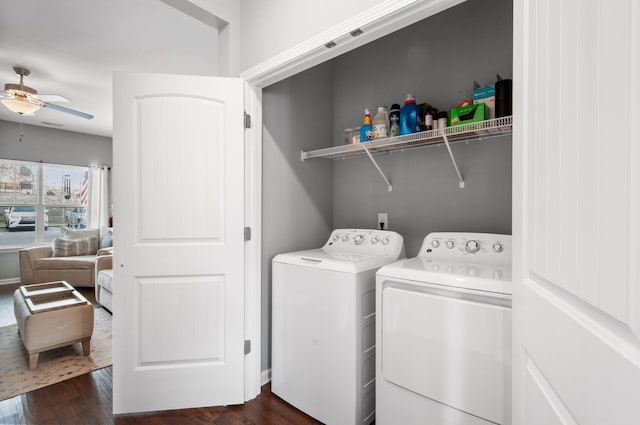 laundry room with dark wood-type flooring, washer and dryer, laundry area, and ceiling fan