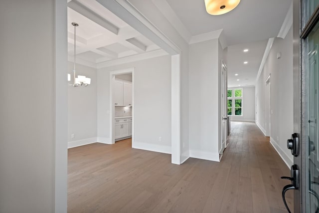 foyer entrance featuring baseboards, coffered ceiling, beamed ceiling, light wood-style floors, and recessed lighting