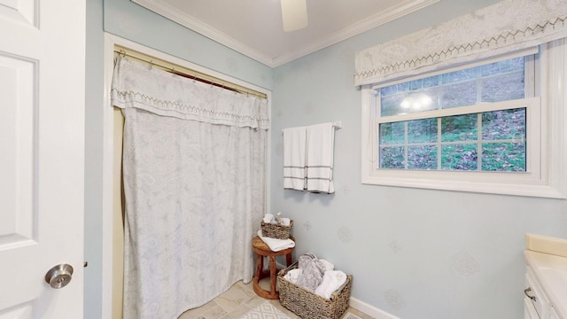 full bath with a ceiling fan, baseboards, vanity, ornamental molding, and a shower with curtain