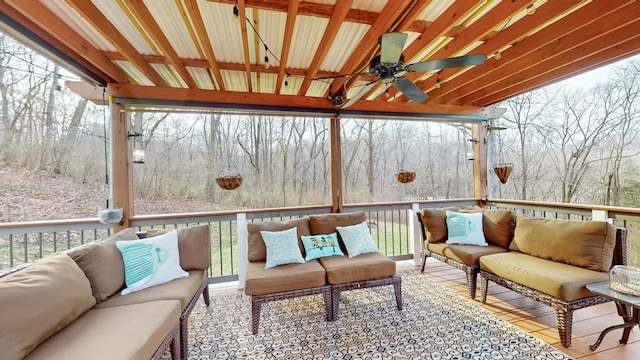 sunroom / solarium with a ceiling fan