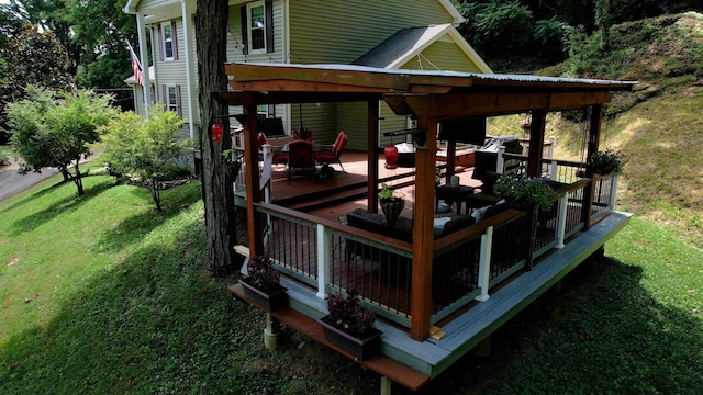 wooden terrace featuring a lawn