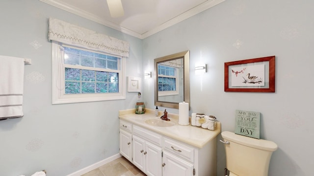 bathroom featuring baseboards, crown molding, vanity, and toilet