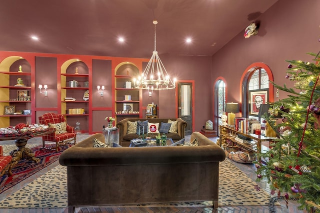 living area featuring a chandelier, recessed lighting, and built in features