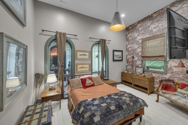 bedroom featuring a high ceiling