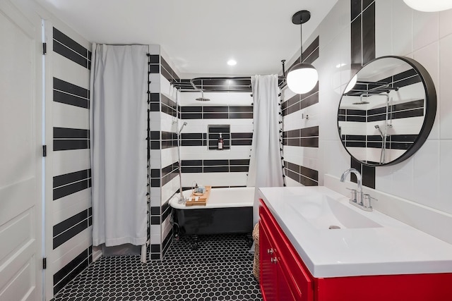 full bath featuring shower / bath combination with curtain, recessed lighting, tile walls, and vanity