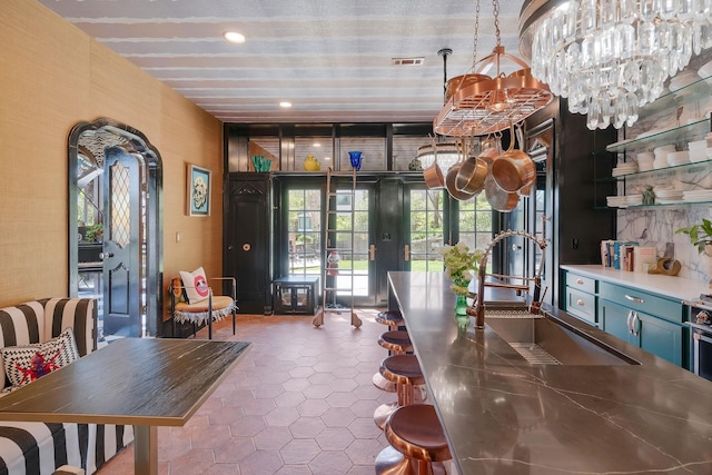 interior space featuring tile patterned flooring, visible vents, french doors, and recessed lighting