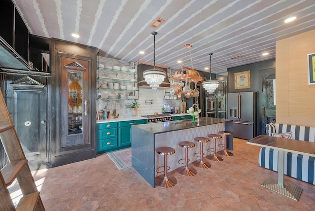 bar featuring visible vents, stone finish floor, pendant lighting, bar area, and high end fridge