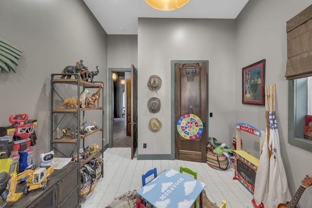 playroom with light tile patterned floors