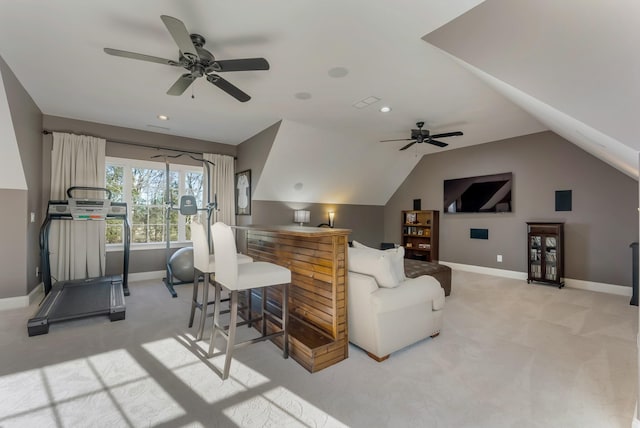 living area with recessed lighting, light carpet, vaulted ceiling, and baseboards