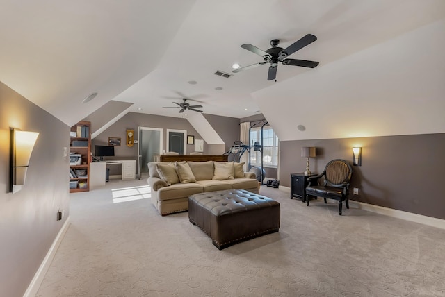 living area featuring baseboards, vaulted ceiling, and light colored carpet