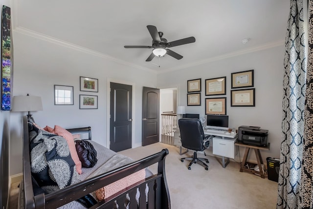 bedroom with ornamental molding, light colored carpet, and ceiling fan