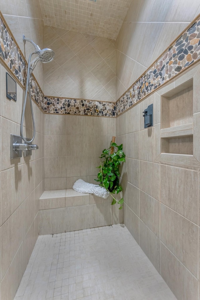 bathroom with a tile shower