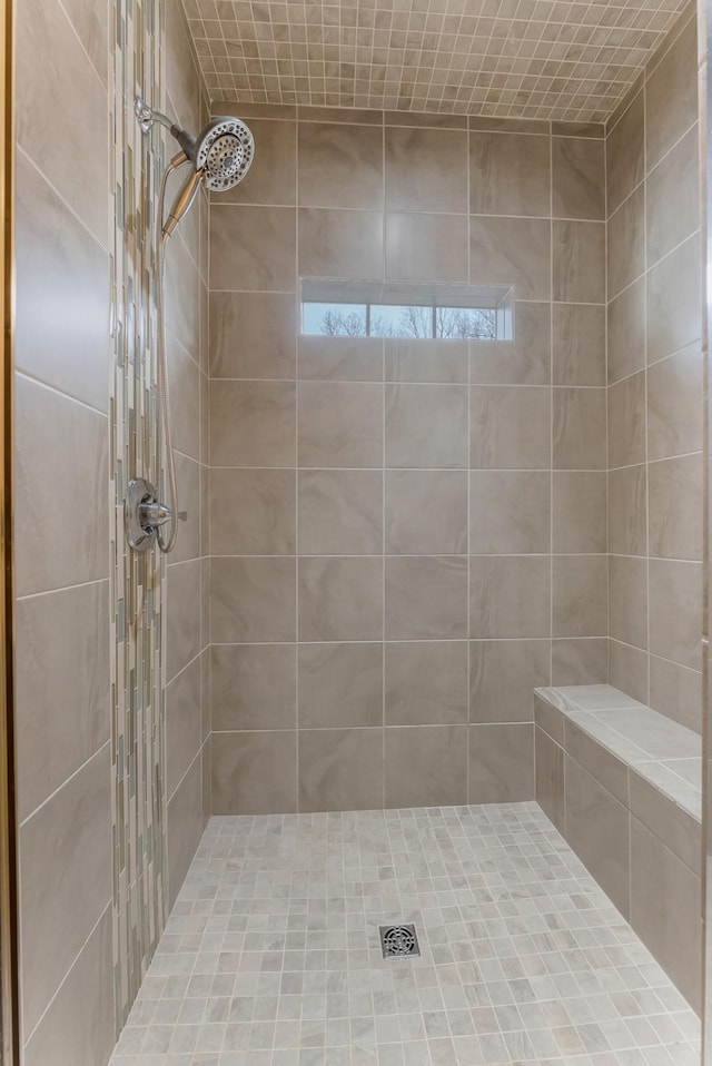 full bath featuring a tile shower