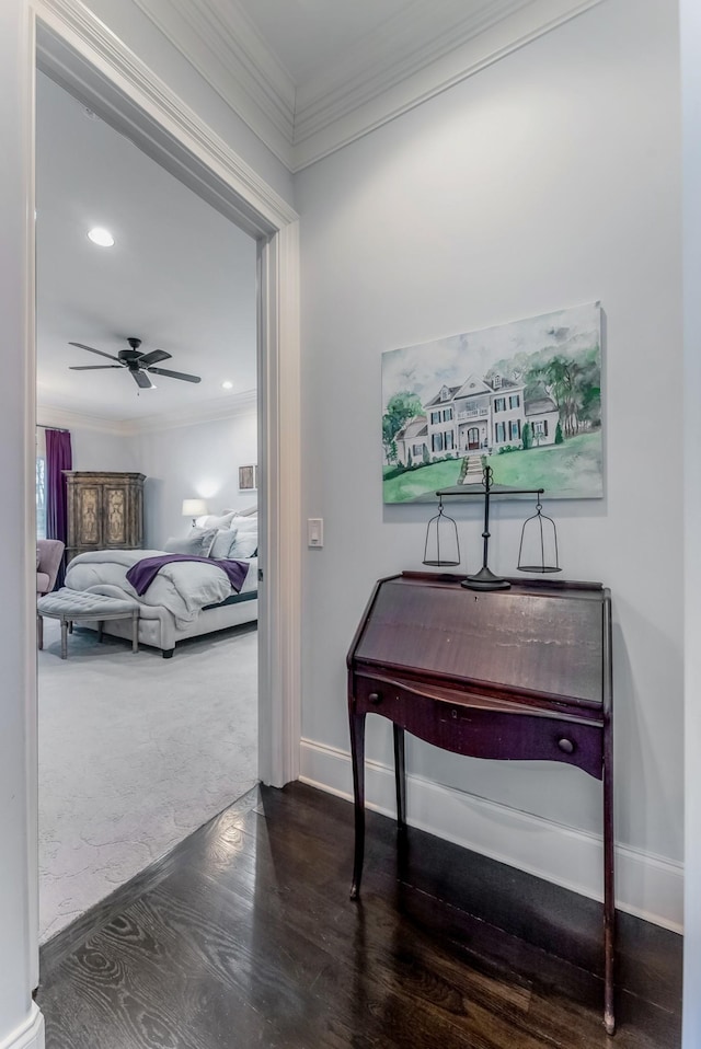 hall with dark wood-style floors, baseboards, crown molding, and recessed lighting