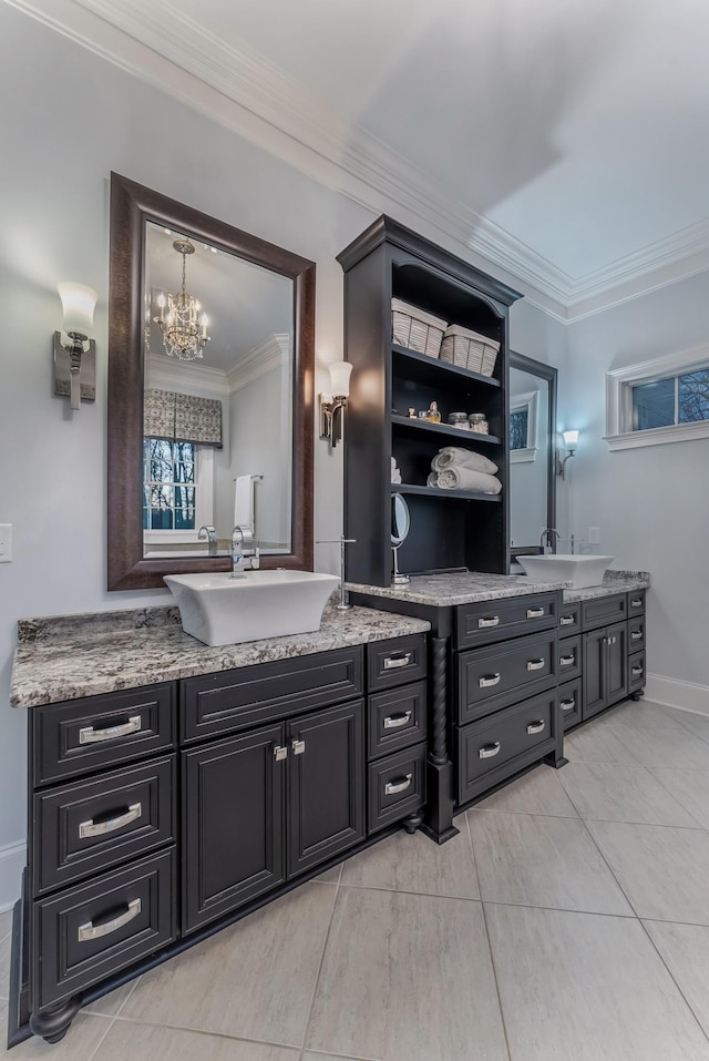 bar featuring baseboards, ornamental molding, a sink, and pendant lighting