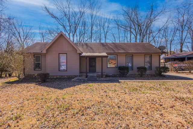 ranch-style home with roof with shingles