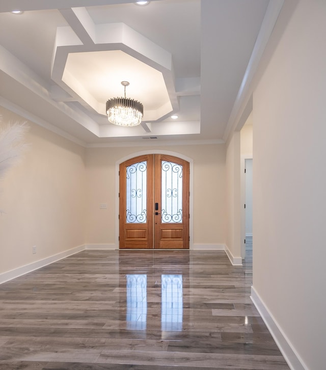 foyer with arched walkways, recessed lighting, baseboards, french doors, and an inviting chandelier