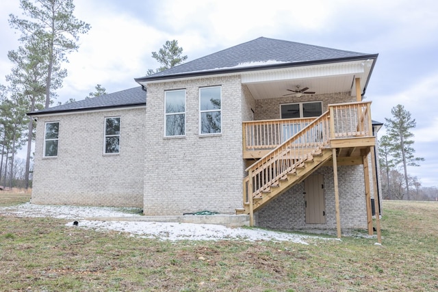 rear view of house with brick siding, ceiling fan, stairway, and roof with shingles