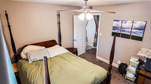 bedroom with dark colored carpet, ceiling fan, and baseboards