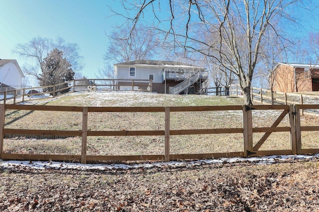 view of gate featuring fence and an enclosed area