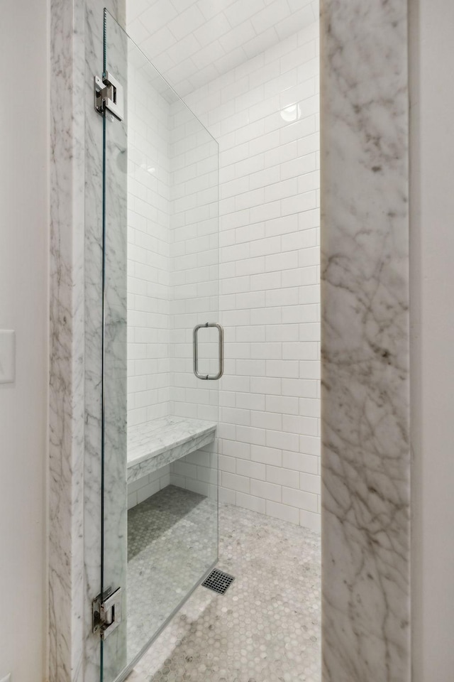 bathroom featuring a stall shower