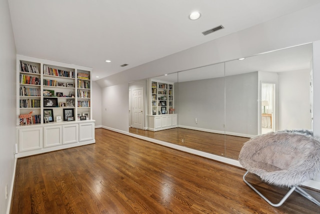 sitting room with built in features, recessed lighting, visible vents, wood finished floors, and baseboards