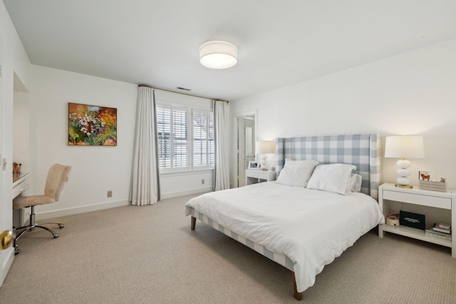 bedroom with carpet floors and baseboards