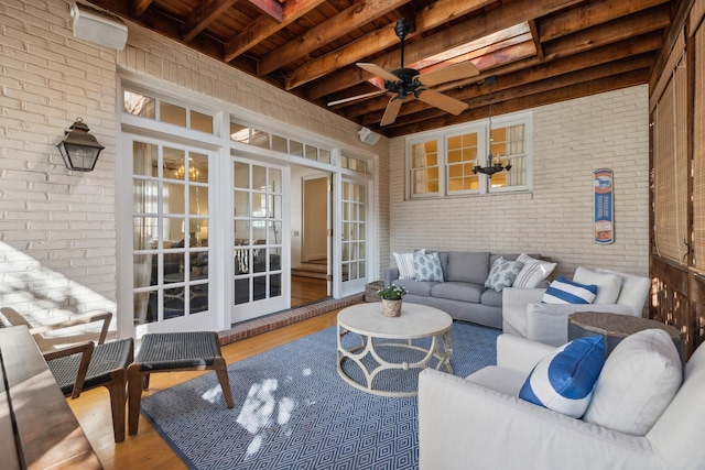 exterior space featuring an outdoor hangout area, french doors, and a ceiling fan