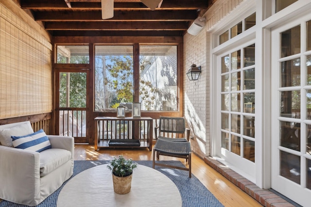 sunroom with beam ceiling