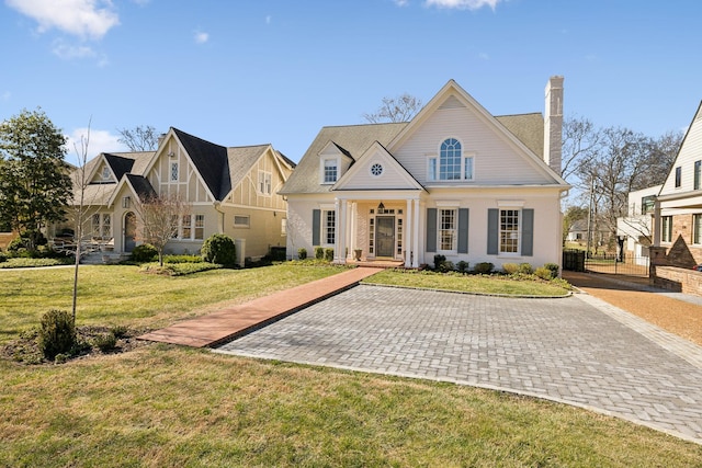 view of front of house featuring a front yard and a chimney