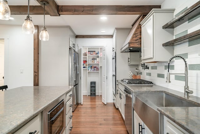 kitchen with pendant lighting, open shelves, beam ceiling, and white cabinets