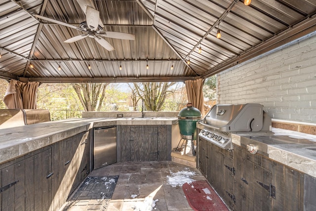 view of patio / terrace with ceiling fan, area for grilling, exterior kitchen, and a gazebo