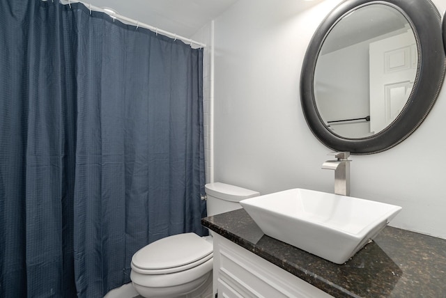 full bathroom with vanity and toilet