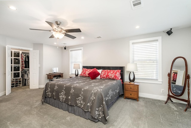 bedroom with ceiling fan, recessed lighting, light colored carpet, visible vents, and baseboards