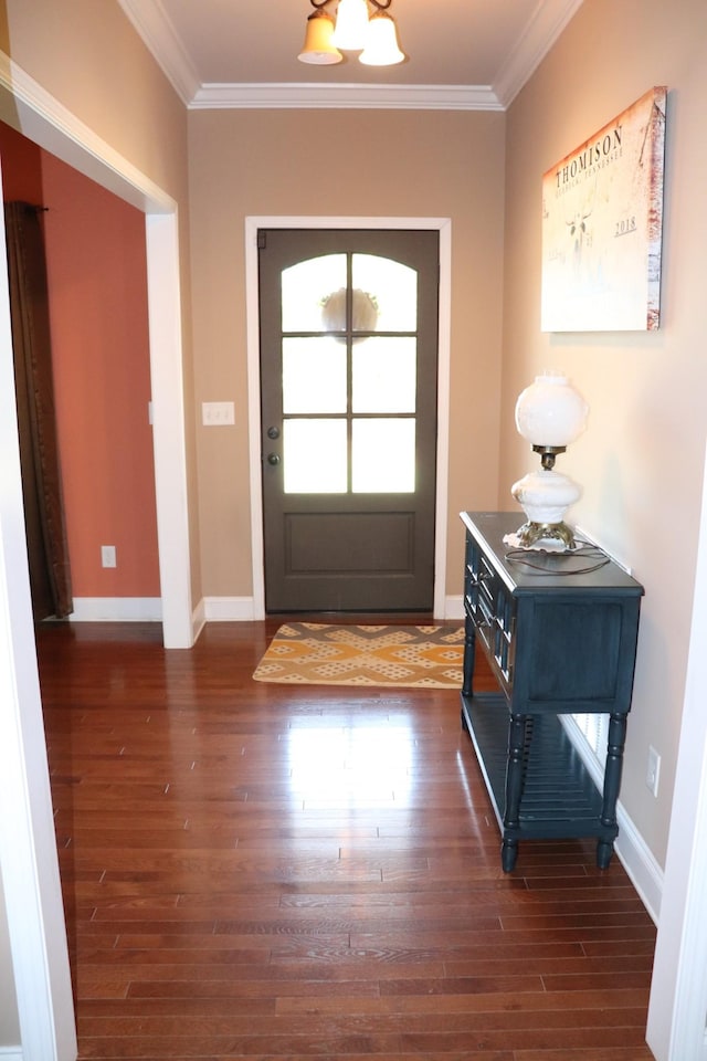 entryway with baseboards, ornamental molding, and dark wood finished floors