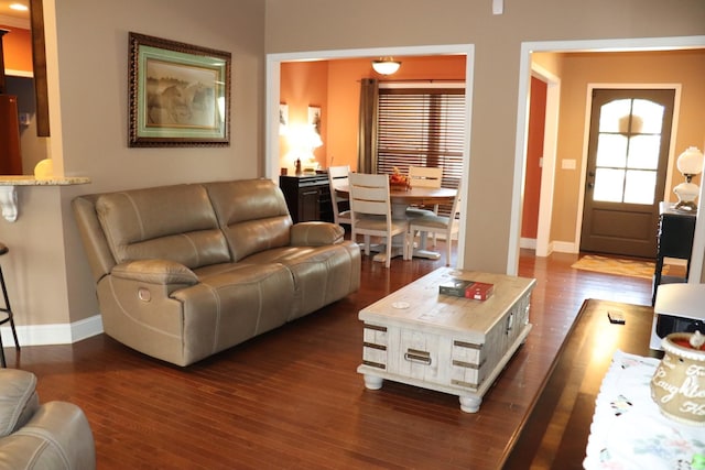 living area featuring dark wood-style floors and baseboards