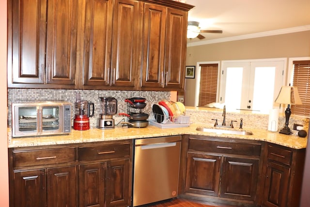 kitchen featuring tasteful backsplash, ornamental molding, ceiling fan, a sink, and dishwasher