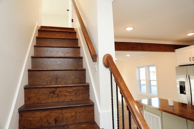 staircase with recessed lighting and visible vents