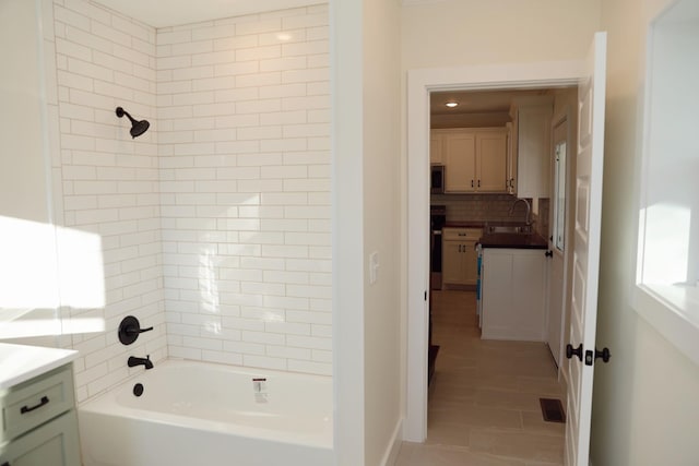 full bathroom with shower / bath combination, visible vents, tile patterned flooring, vanity, and backsplash