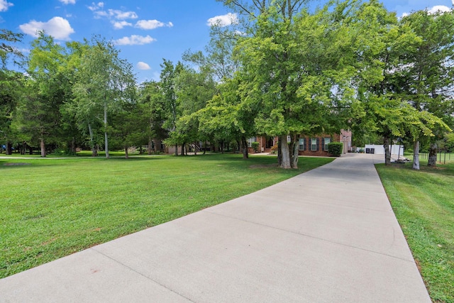 view of property's community with a yard