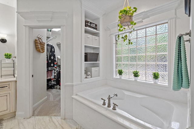 full bath featuring a walk in closet and a bath