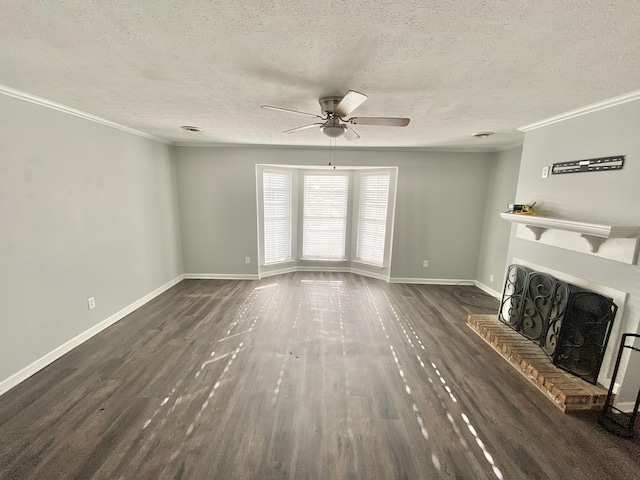 unfurnished living room with baseboards, a ceiling fan, ornamental molding, dark wood-type flooring, and a fireplace