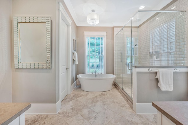 full bath with a stall shower, baseboards, a soaking tub, ornamental molding, and vanity