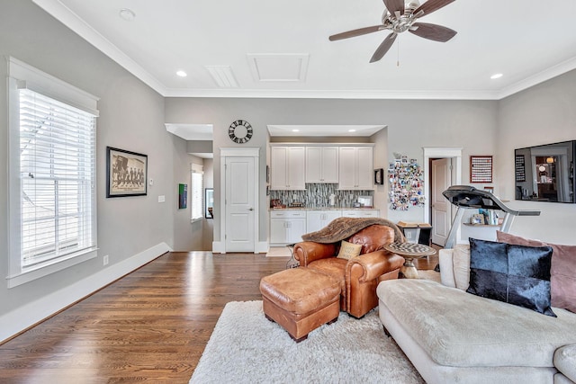 living room featuring ceiling fan, recessed lighting, baseboards, dark wood finished floors, and crown molding